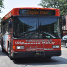image of an orange colored bus in downtown Stroudsburg